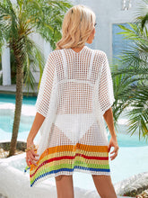 Back view of white slit openwork V-neck half sleeve cover-up showing relaxed fit and breezy openwork design