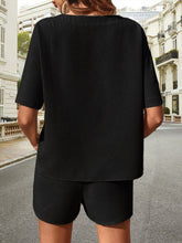 Back view of Soft But Savage Waffle-Knit Set in black, highlighting relaxed silhouette and textured fabric.