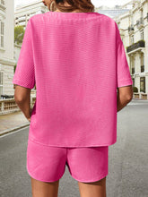 Back view of Soft But Savage Waffle-Knit Set in fuchsia pink, highlighting relaxed silhouette and textured fabric.