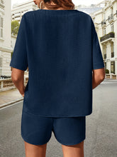 Back view of Soft But Savage Waffle-Knit Set in navy, highlighting relaxed silhouette and textured fabric.