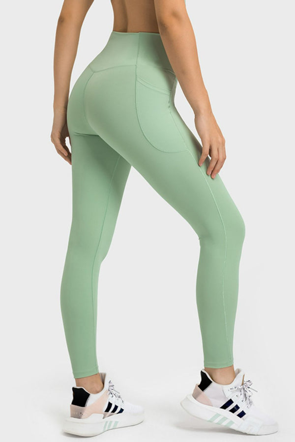 side walking view wearing solunexa fit leggings mint