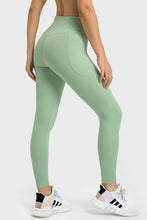 side walking view wearing solunexa fit leggings mint