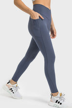 side view hand in pocket on solunexa fit leggings steel