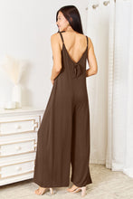 Adjustable back tie in Mocha styled in a loose bow, adding elegance to this easygoing look.