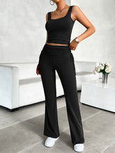 Side profile of black Solvenza MoveEase Lounge Set, showing flattering tank cut and flowing pants.
