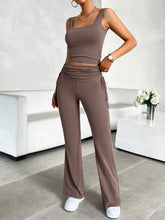 Model in taupe Solvenza MoveEase Lounge Set, front view showing square neck tank and bootcut pants.
