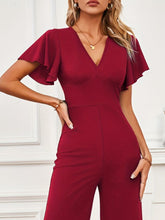 Close-up of Burgundy Soralia DrapeSuit’s luxurious, soft-touch polyester-spandex fabric and color-retentive texture highlighting the plunging V-Neck.
