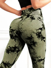close up back view of spectraflow bootcut leggings army green highlighting fabric texture