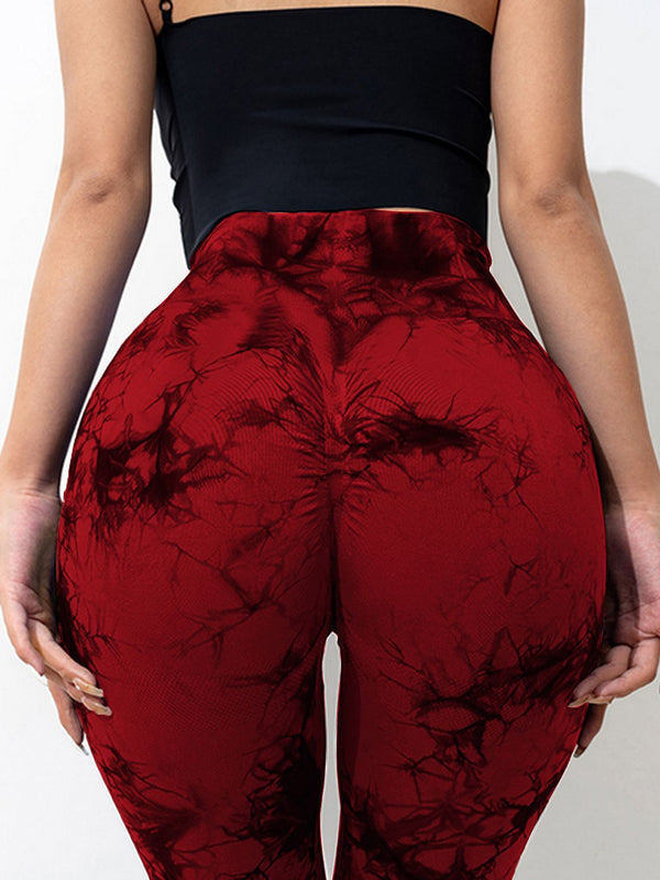 close up back view of spectaﬂow bootcut leggings burgundy highlighting fabric texture