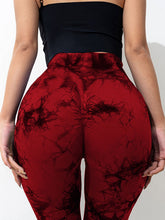 close up back view of spectaﬂow bootcut leggings burgundy highlighting fabric texture