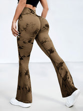 back view stretching pose in spectraflow bootcut leggings coffee brown