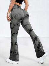 back view of spectraflow bootcut leggings dark gray highlighting fabric texture