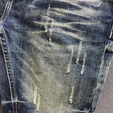 Close-up of ripped leg accent and washed denim design on StoneRidge Skinny Jean Shorts.
