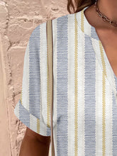 Close-up of the design on the stripe Printed Notched Short Sleeve Blouse.