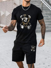 Man wearing swag teddy bear graphic black short set while shopping at the mall