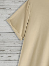 Back flat lay close-up of short sleeve detail from teddy bear khaki shirt
