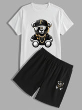 Full front flat lay of white teddy bear logo shirt and black shorts set