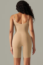 Tan active romper back view showing thick spaghetti straps and contoured fit.