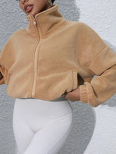 tan turtleneck zip up jacket casual neckline outfit
