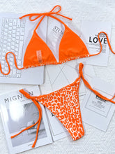 Tangerine leopard print halter neck tie side bikini set back flat lay view