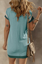 Back view of teal Nolavelle dress showcasing clean lines and relaxed fit.