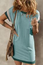 Front view of teal Nolavelle mini dress featuring ribbed texture and striped sleeve cuffs.