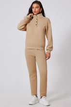 Close-up of half-snap turtleneck snaps and soft fabric texture on TerraSync top.