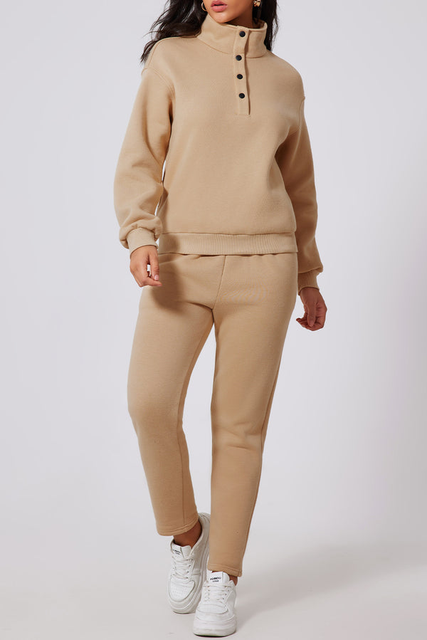 Model in Dust Storm TerraSync HalfSnap Active Set, front view showing turtleneck snaps and relaxed pants.