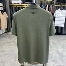 TexturaLoom Men’s Embossed Letter Polo Army Green Back View on Hanger.