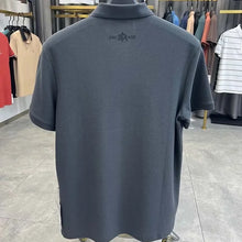 TexturaLoom Men’s Embossed Letter Polo Dark Grey Back View on Hanger.