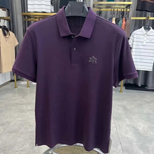 TexturaLoom Men’s Embossed Letter Polo Purple Front View on Hanger.