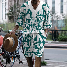 Model front view wearing Tropiverno™ Prism Tide Green Floral Print Shorts Set with V-neck shirt and matching shorts