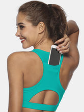 Turquoise cutout scoop neck active tank back view showing pocket.