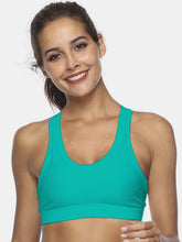 Turquoise cutout scoop neck active tank front view on model.