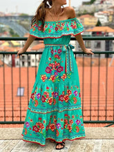 Detail shot of ruched bodice and ruffle sleeve on turquoise Isadorae Dress.