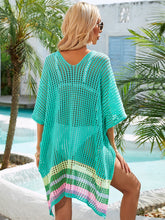 Back view of turquoise slit openwork V-neck half sleeve cover-up showing relaxed fit and breezy openwork design