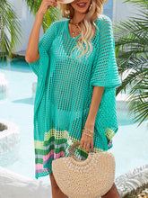 Model wearing turquoise slit openwork V-neck half sleeve cover-up at poolside with airy openwork texture and above-the-knee length, styled with straw hat 