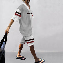 Side view of Valverro StriLux Set with jewelry and sandals, holding shopping bag.