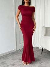 Model wearing burgundy Vareliya Ruched One-Shoulder Maxi Dress styled with gold jewelry and nude heels.