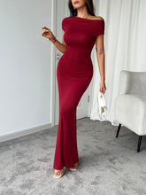 Model wearing burgundy Vareliya Ruched One-Shoulder Maxi Dress styled with gold jewelry and nude heels.