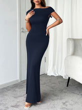 Side profile of model in dark blue Vareliya Maxi Dress showing soft ruched detailing.