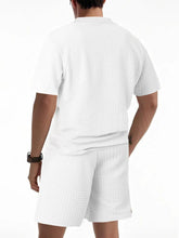 Back view of men’s white Vayrix TextureFlex top and shorts set showcasing pique textured fabric and relaxed fit