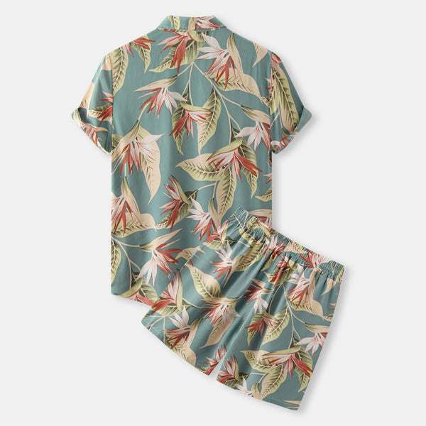 Back flat lay of Velnox Riviera Set showing rear view of shirt and shorts with tropical floral design and soft polyester texture.