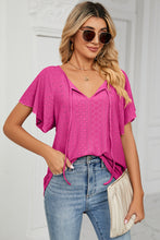 Detail shot of flutter sleeves and embroidered eyelets on Veluretta Mistflair Blouse in hot pink.