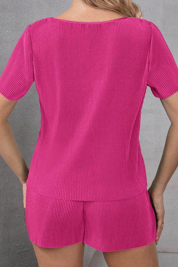 Back view of Velviluxe™ hot pink shorts set featuring corduroy velvet texture and relaxed fit on model.