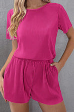 Model wearing Velviluxe™ hot pink corduroy velvet shorts set, front view showing satin-trimmed neckline and elastic waist shorts.