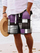 Man walking on beach wearing light purple geometric color block shorts.