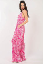 Model’s side profile showcasing the sleeveless cut and effortless wide-leg drape of the jumpsuit.