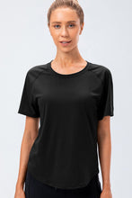 Verzana Active Tee in black — front view with minimalist raglan design.