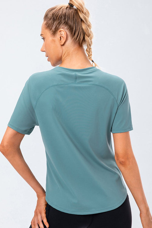 Verzana Active Tee in teal — back view, breathable stretch fabric.
